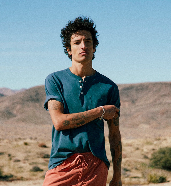 man wearing blue henley in the desert
