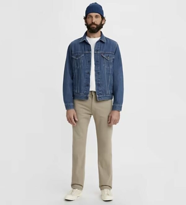 a man wearing a denim jacket with pants