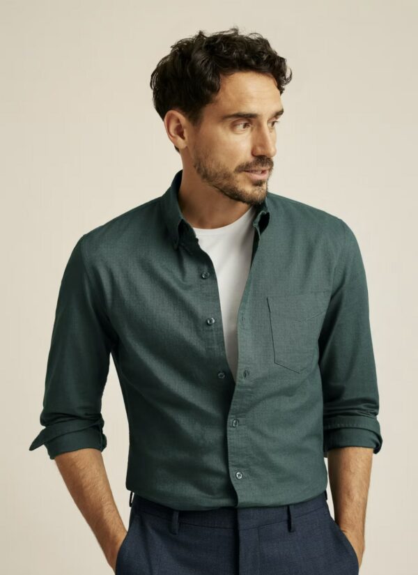 a man wearing a button front oxford shirt