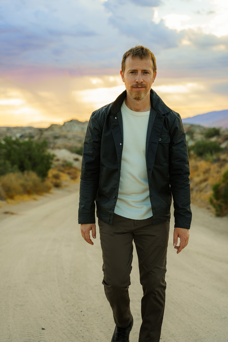 Black Thursday Waxed Canvas Jacket - fall outfit with black jacket, beige thermal, brown chinos