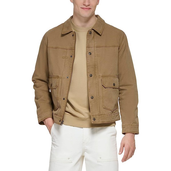 a man wearing a trucker shirt over a shirt and pants