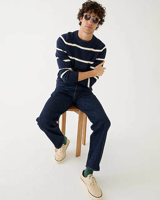 man wearing striped navy sweater