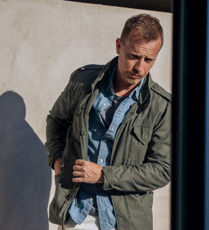 olive green field jacket with chambray shirt - man wearing a fall style outfit