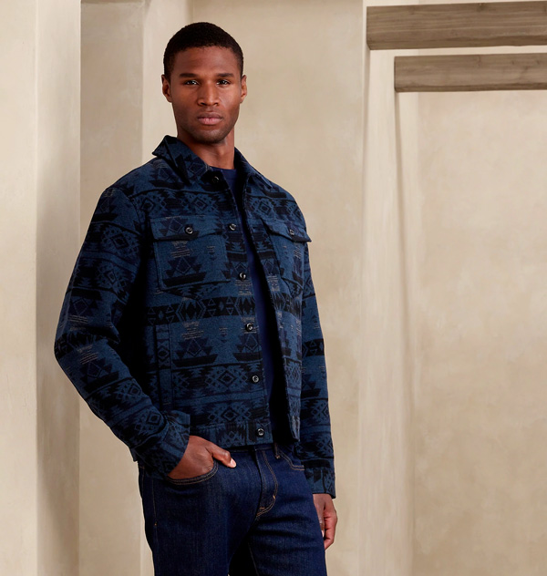 man wearing blue and black patterend trucker jacket