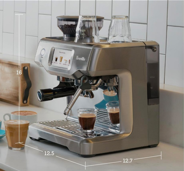 Breville espresso maker on counter with dimensions indicating 16 inches tall, 12.5 inches wide and 12.7 inches deep