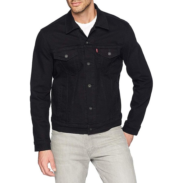 a man wearing a trucker style jacket with pants