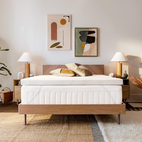 a bed with a memory foam mattress topper