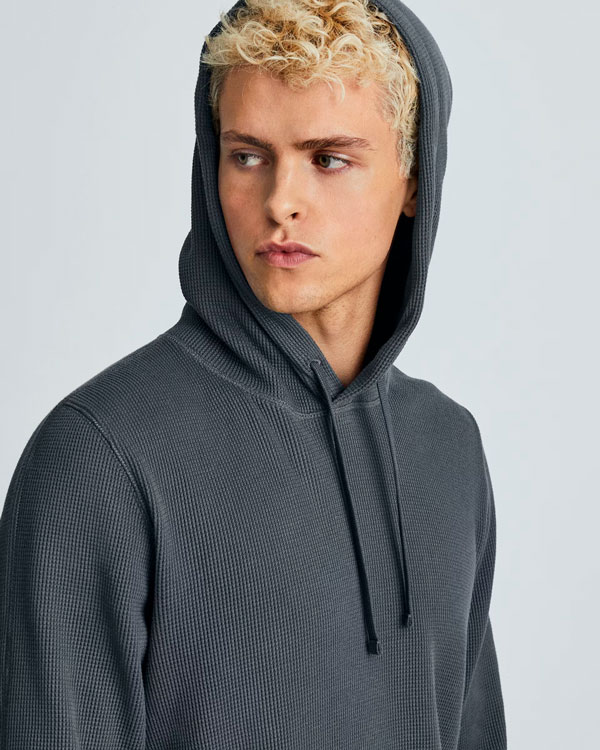 man wearing gray waffle knit hoodie