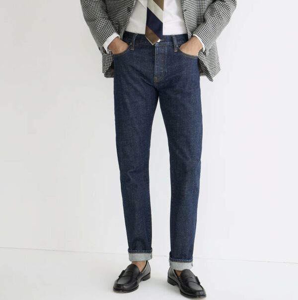 man wearing denim jeans with dress shoes