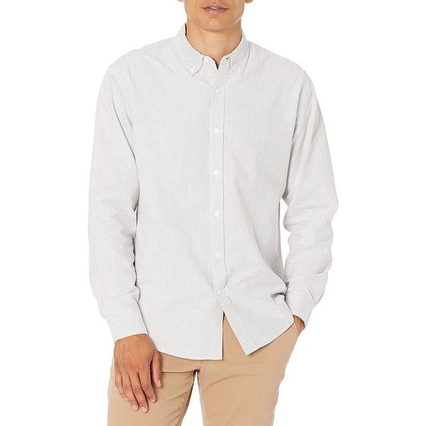 a man wearing an oxford shirt and pants