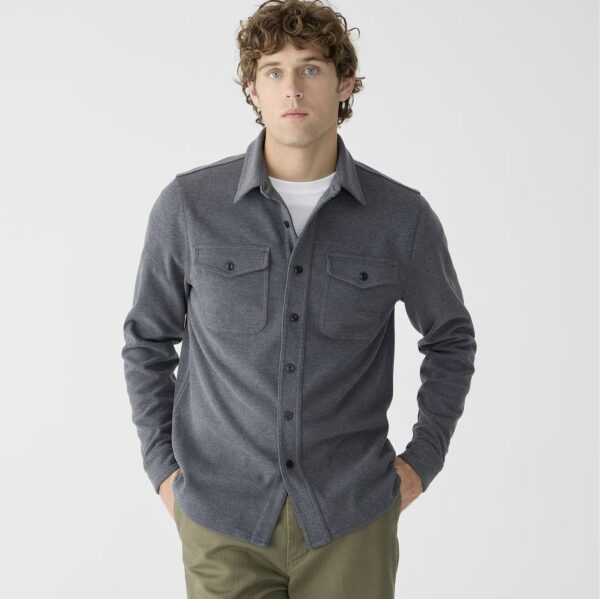 man wearing a knit button down long sleeve shirt and pants