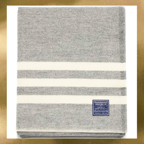 a grey blanket with three white stripes