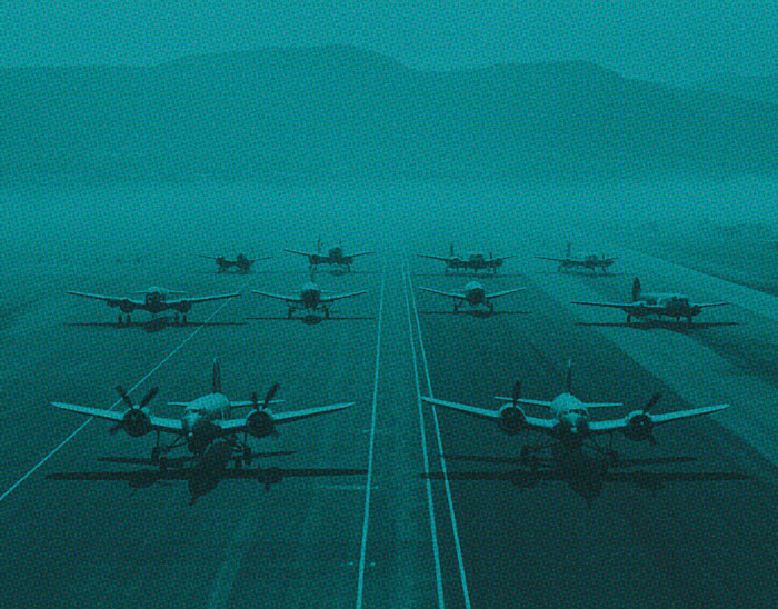 vintage photograph of planes on. runway