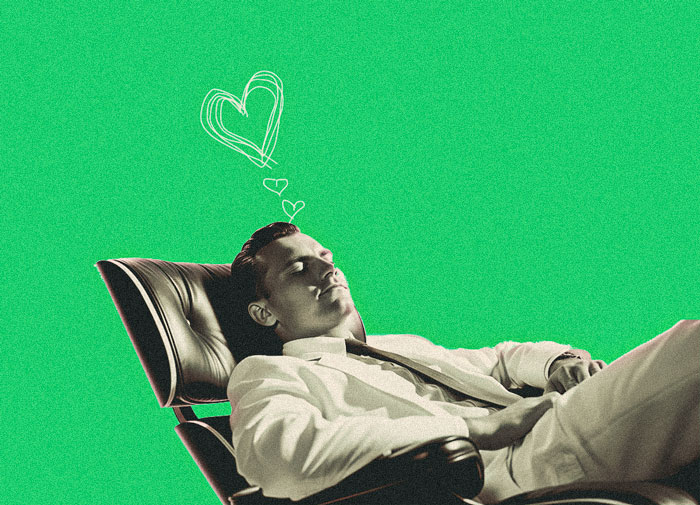 vintage photo of a man day dreaming with hand drawn hearts above his head