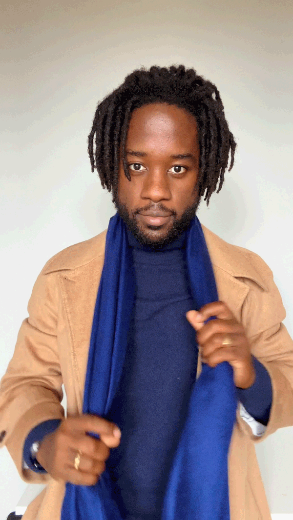 animated gif of man tying once around scarf: wrap end fully around neck and adjust loop shape to taste.