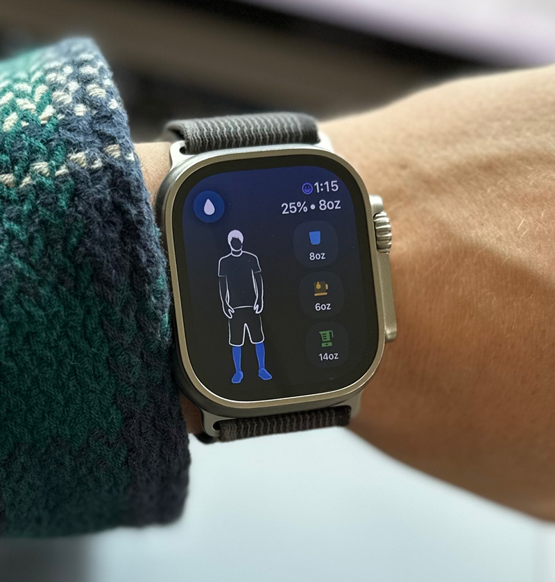 a close up of an apple watch displaying the waterminder app ui for adding water intake