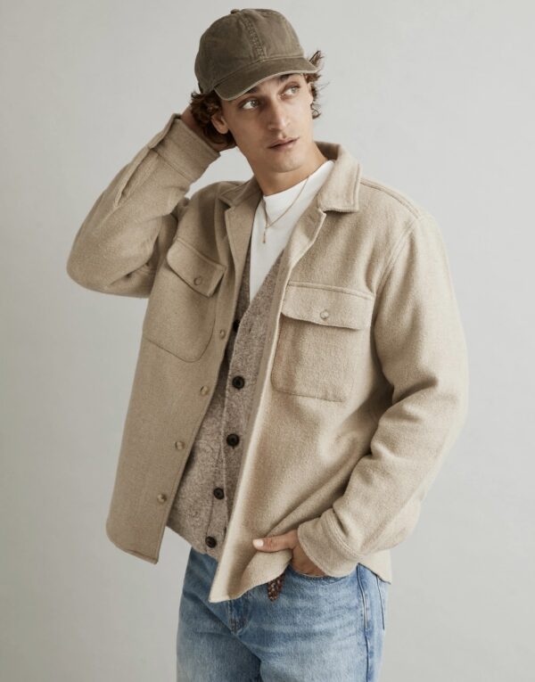 a man wearing a man wearing a brushed shirt jacket over a shirt and button front cardigan