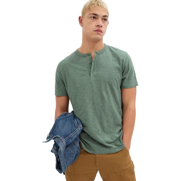 a man wearing a short sleeve henley shirt