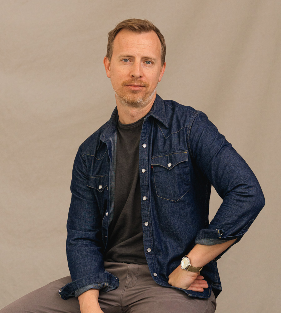 andrew wearing a dark blue levi's denim western shirt