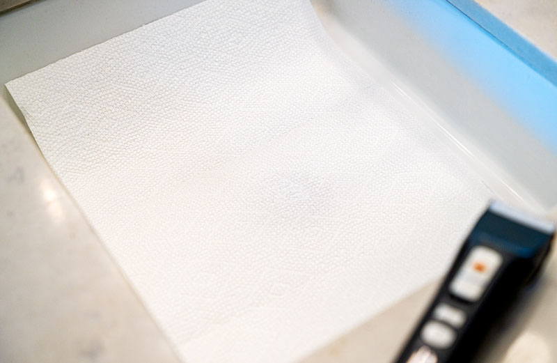 a paper towel in the bottom of the sink before shaving for easy clean up