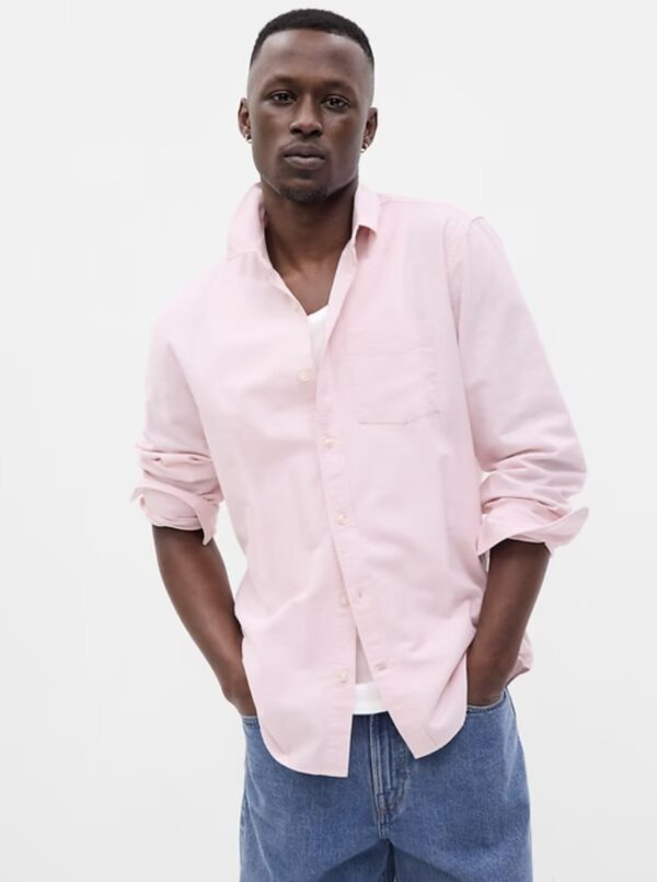 a man wearing a button front oxford style shirt