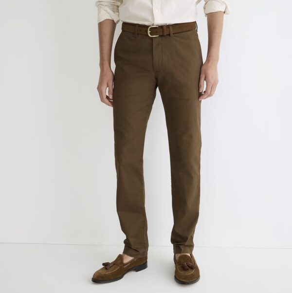 a man wearing slim fit chino pants with loafer shoes