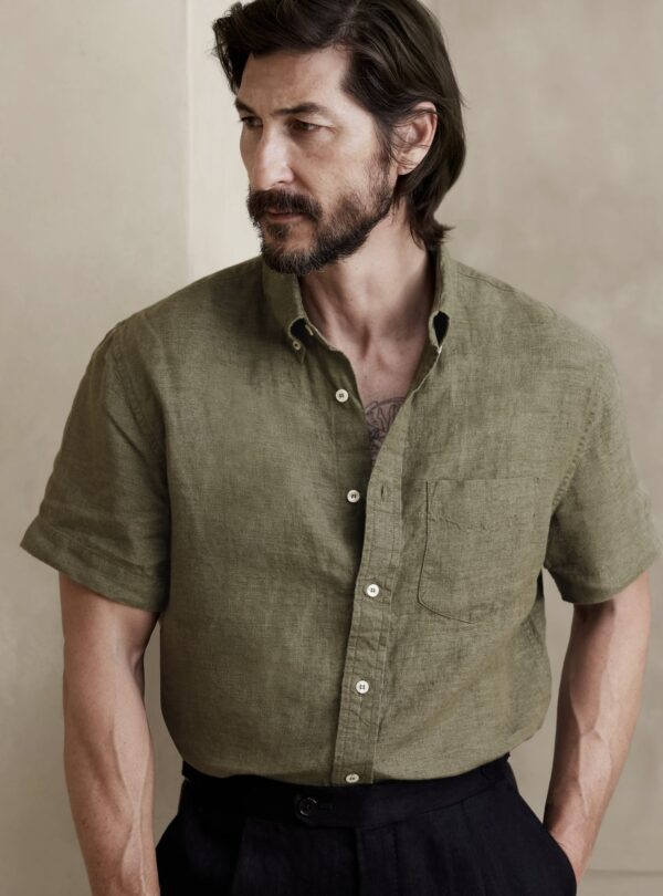 a man wearing a short sleeve button front linen shirt