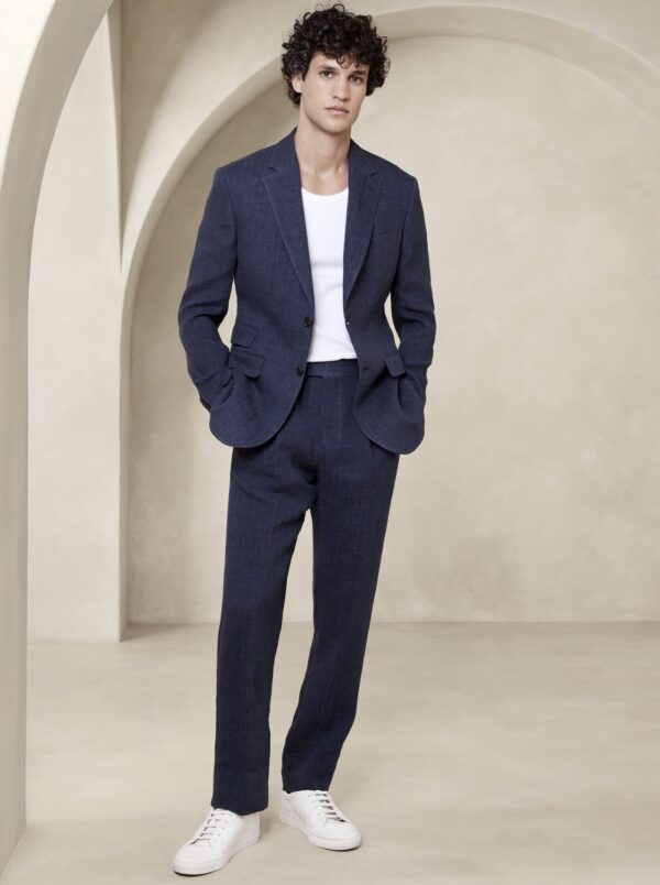 a man wearing a linen suit set with a crew neck shirt