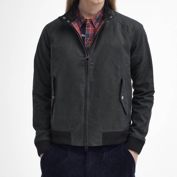man wearing a waxed canvas harrington style jacket