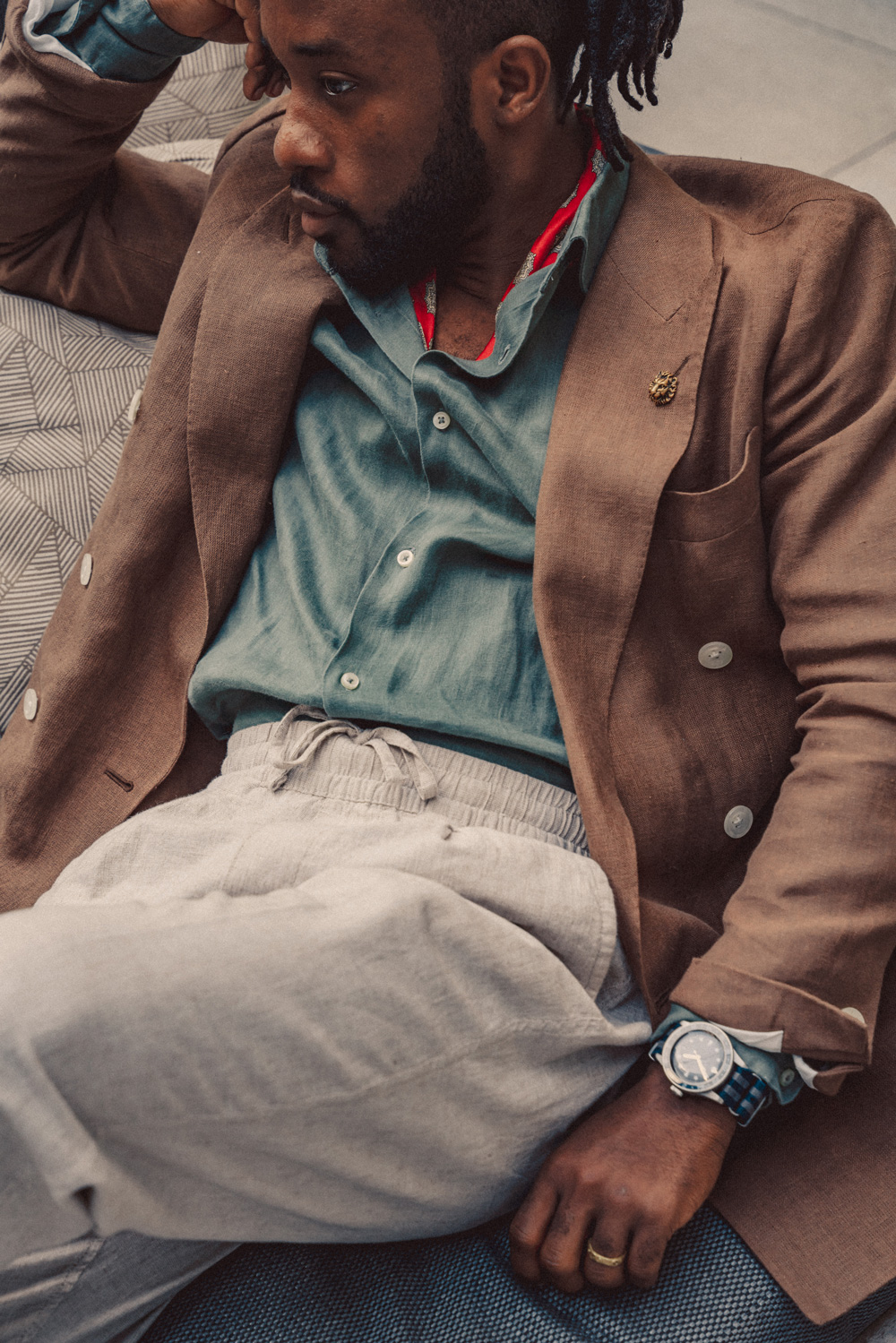 daniel wearing a linen coat, shirt, and pants