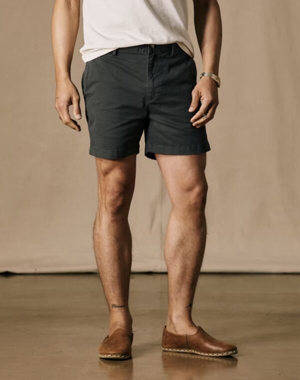 a man wearing shorts with a 5 inch inseam and loafer style shoes