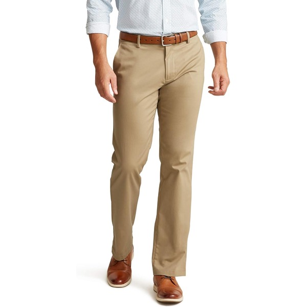 a man wearing straight fit khaki pants with dress shoes and an oxford style shirt