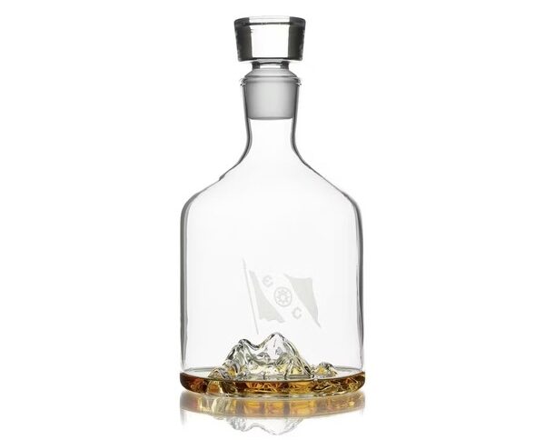 a glass decanter with tophographic image of mount everest