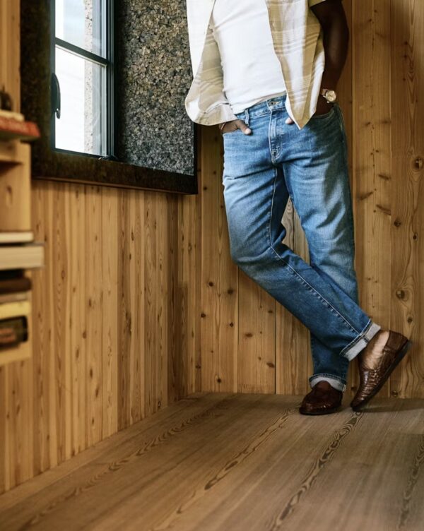 a man wearing japanese selvedge denim jeans with loafer shoes