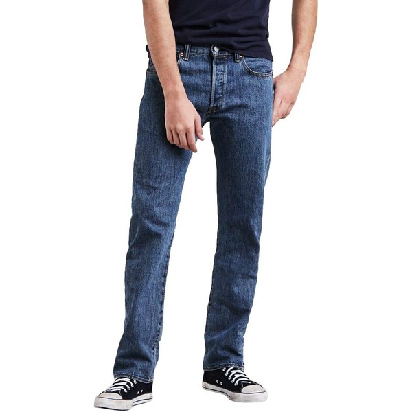 man wearing original fit denim jeans with a casual shirt and sneakers