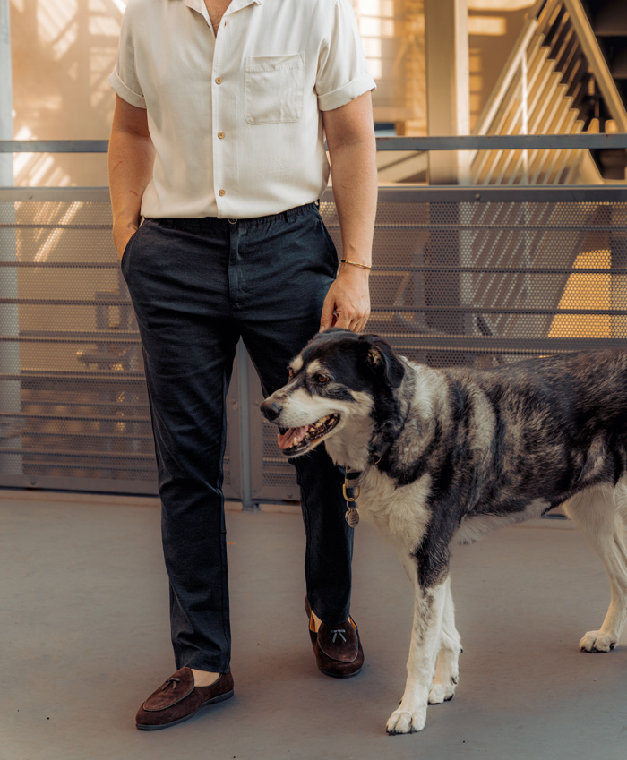 man wearing linen dress pants with a short sleeve button front shirt and loafers