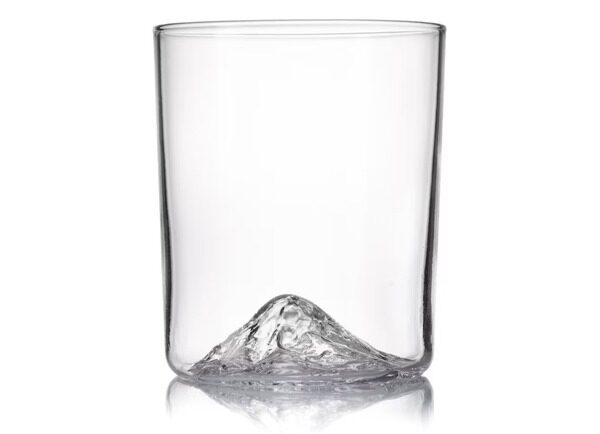 a whiskey glass with topographic impression of Mount Rainier