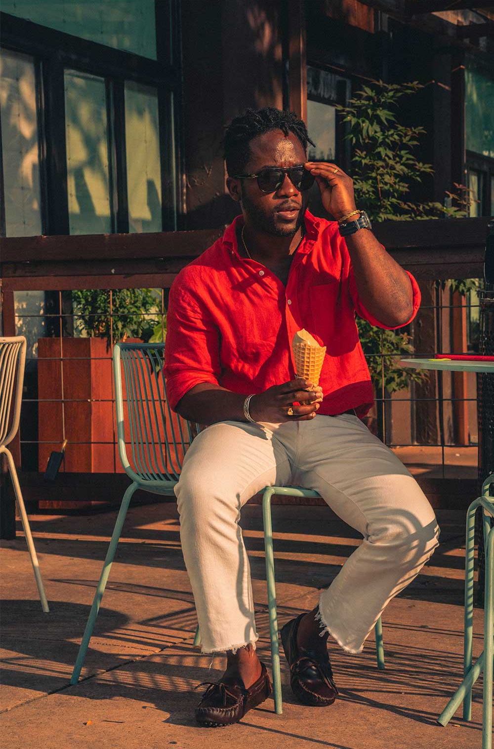 men's summer outfit with red linen shirt and white jeans with brown driving loafers