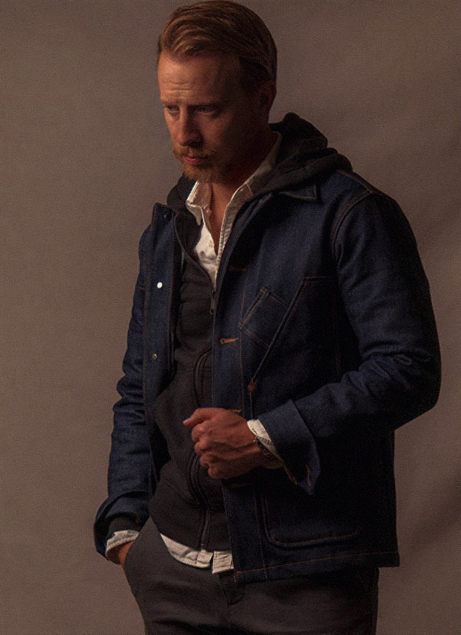 andrew wearing a tellason selvedge denim chore coat over a black hoodie and white button up shirt