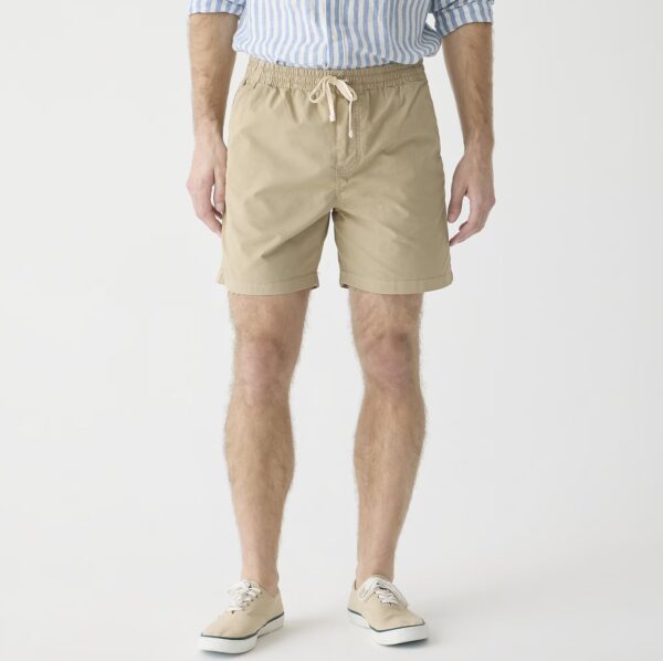 a man wearing drawstring waist dock style shorts with casual shoes