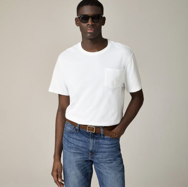 a short sleeve pocket shirt with jeans and sunglasses