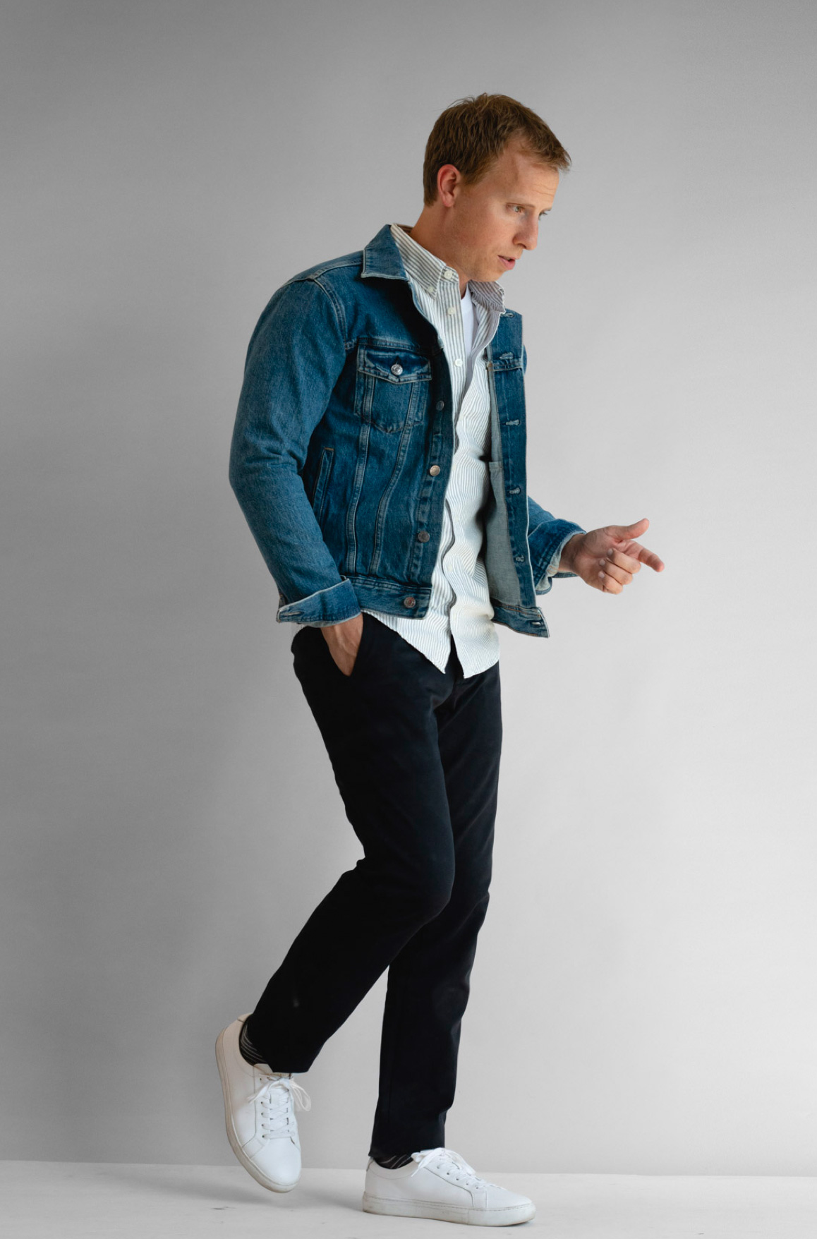 medium wash jacket with striped oxford shirt with navy chinos