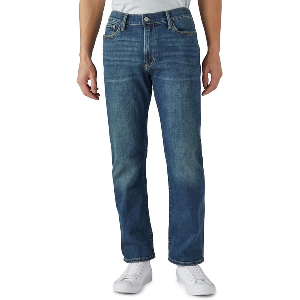 a man wearing straight fit denim jeans with casual shoes