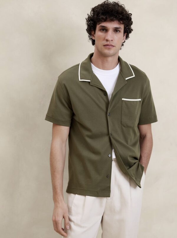 a man wearing a short sleeve button front resort style shirt