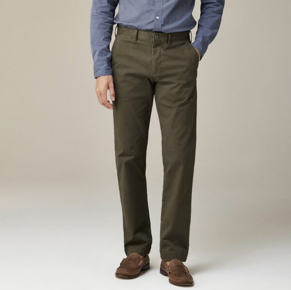 a man wearing straight fit chino pants with loafers