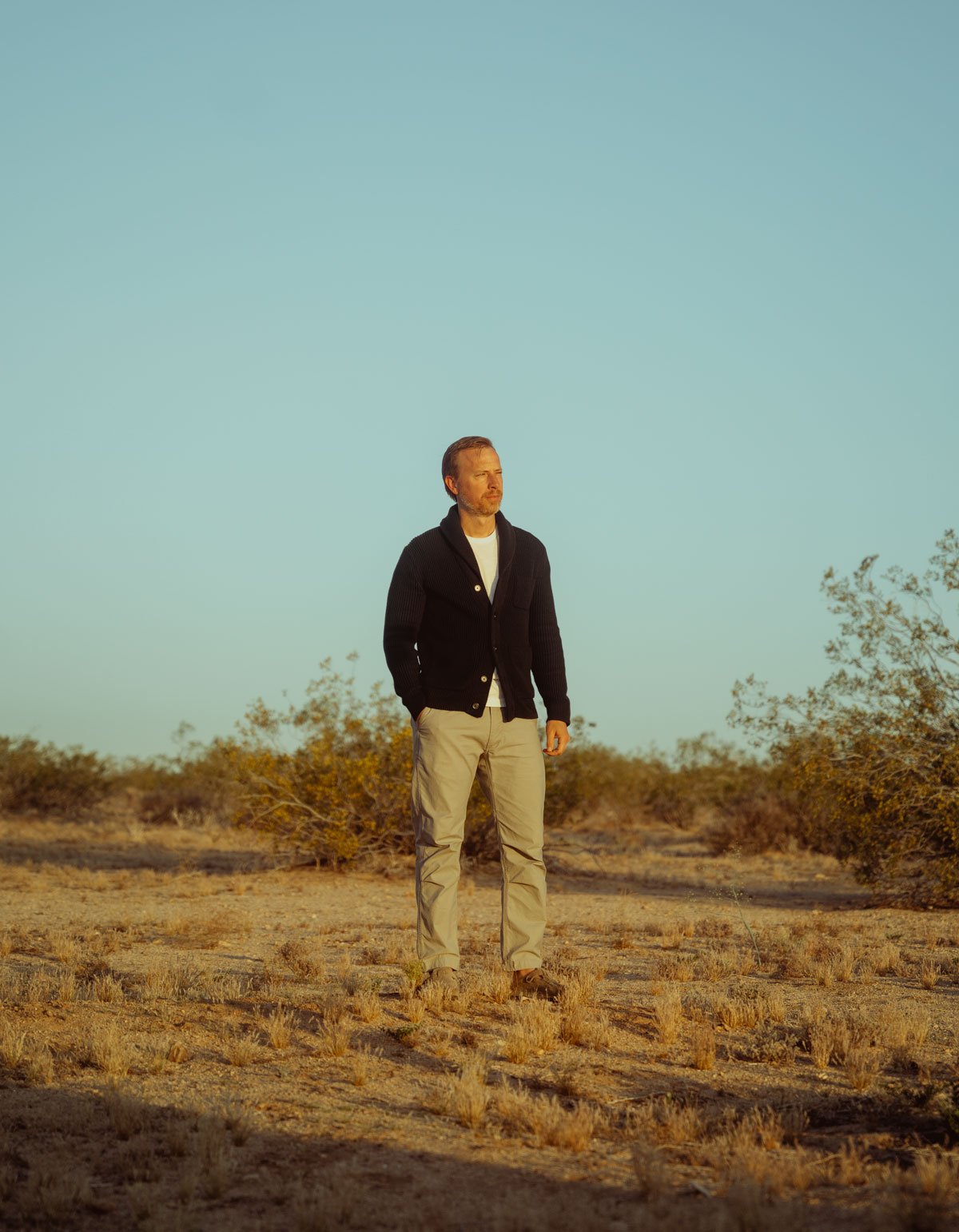 men's fall outfit idea with black sweater and khakis