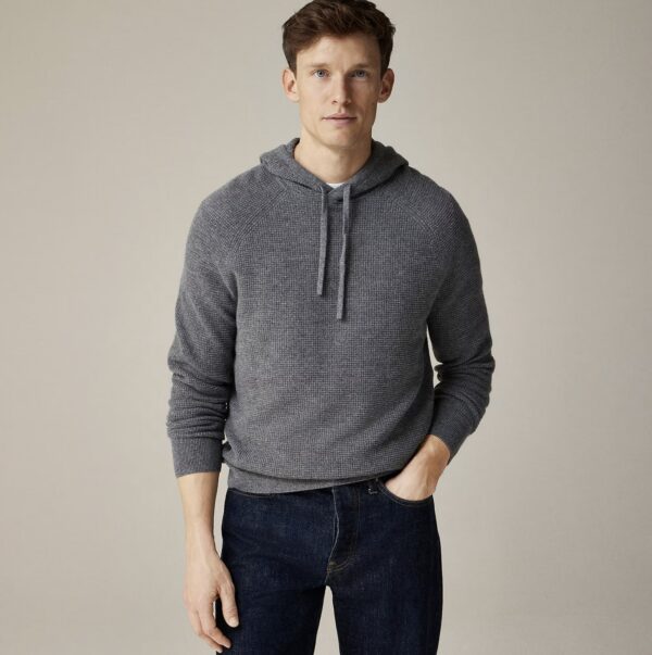 man wearing a cashmere waffle hooded sweater over pants