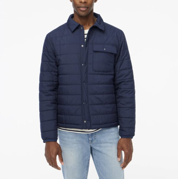 a man wearing a jersey quilted jacket over a denim jeans