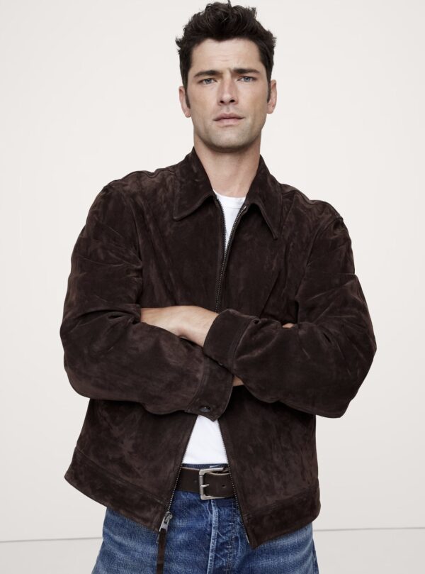 a man wearing a zip front suede jacket over a casual crew neck shirt