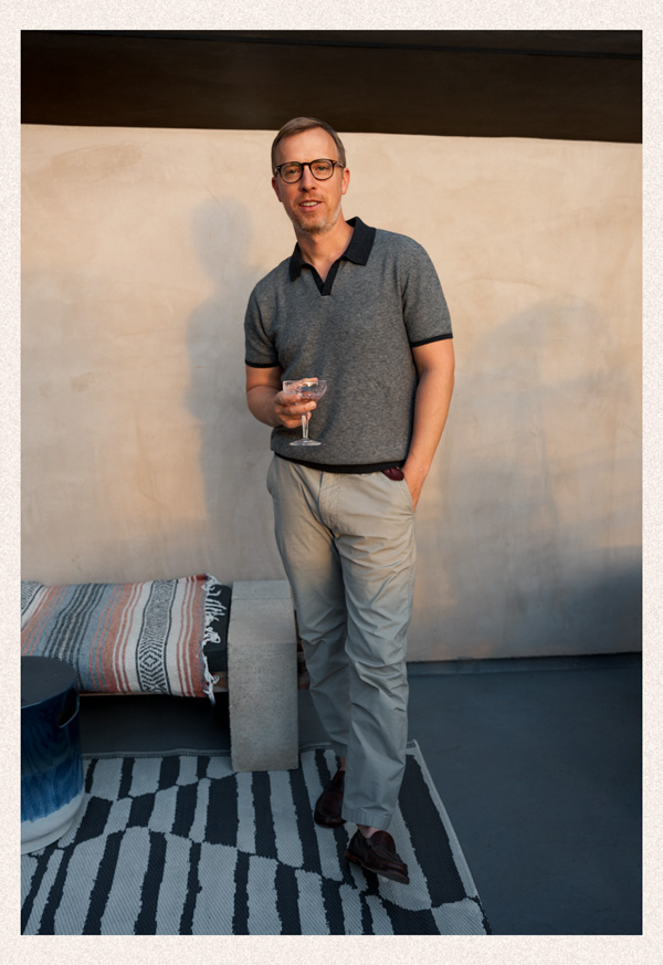 Fall men's outfit idea with sweater polo, khakis, and penny loafers